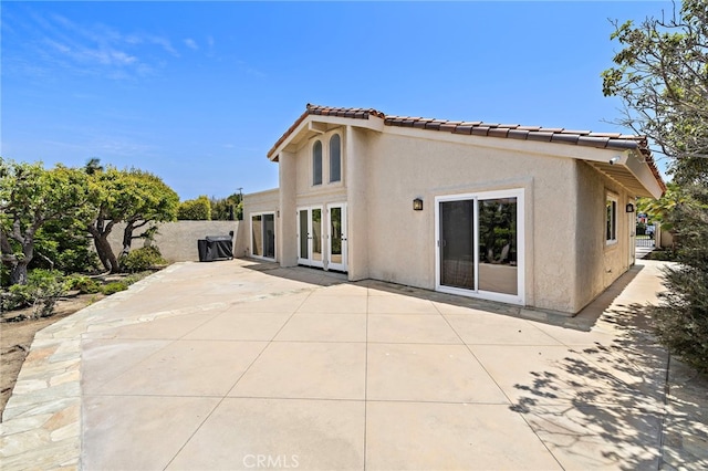 24191 Vis D Oro, Dana Point, CA 92629 - back of property featuring a patio, stucco siding, a tile roof, and french doors