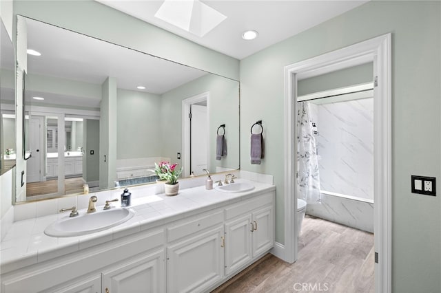24191 Vis D Oro, Dana Point, CA 92629 - full bath with a skylight, double vanity, wood finished floors, and recessed lighting