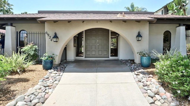 6924 Hyde Park Dr Unit 106, San Diego, CA 92119 - property entrance with stucco siding and a shingled roof