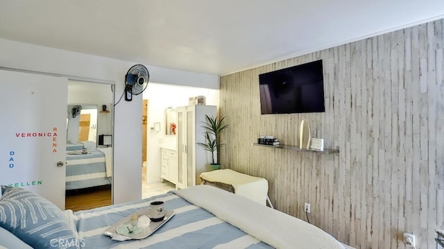 6924 Hyde Park Dr Unit 106, San Diego, CA 92119 - bedroom featuring wooden walls and ensuite bath
