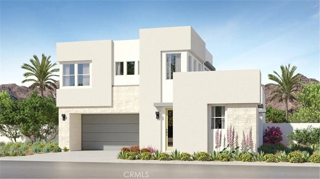 2658 Bandit Ln, Palm Springs, CA 92264 - contemporary house featuring an attached garage, stucco siding, and driveway