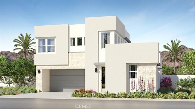 2658 Bandit Ln, Palm Springs, CA 92264 - contemporary house featuring an attached garage, stucco siding, and driveway