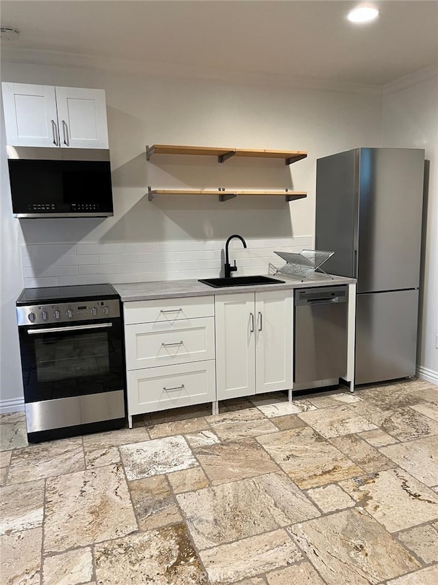 23911 Homezell Dr, West Hills, CA 91304 - kitchen featuring open shelves, stainless steel appliances, crown molding, white cabinetry, and stone tile floors