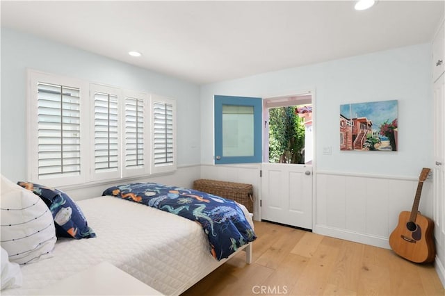 113 Via Yella, Newport Beach, CA 92663 - bedroom featuring wood finished floors, a wainscoted wall, and recessed lighting