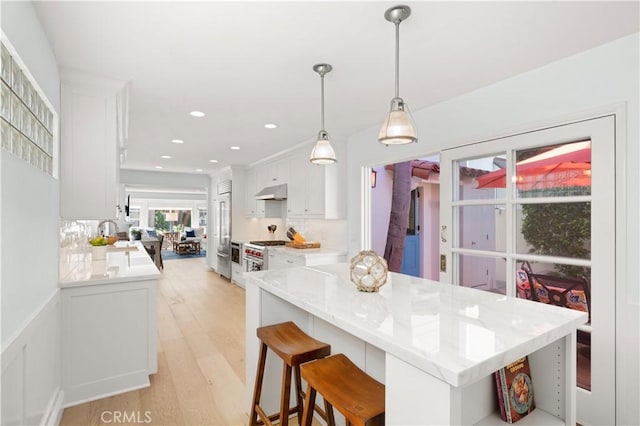 113 Via Yella, Newport Beach, CA 92663 - kitchen featuring white cabinetry, open shelves, light wood-type flooring, under cabinet range hood, and recessed lighting