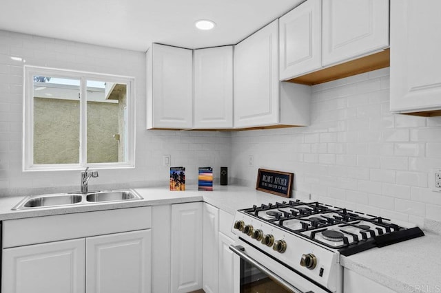 3015 Iris Ave Unit F, San Ysidro, CA 92173 - kitchen with high end white range oven, white cabinets, light countertops, and tasteful backsplash