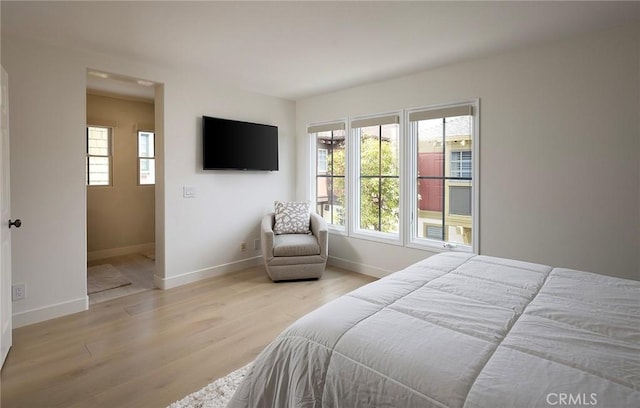 2534 Bungalow Pl Unit 87, Corona Del Mar, CA 92625 - bedroom featuring wood finished floors and baseboards