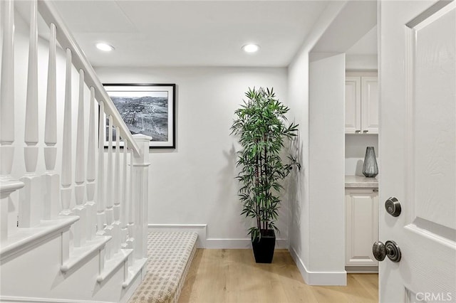 2534 Bungalow Pl Unit 87, Corona Del Mar, CA 92625 - stairway featuring wood finished floors and recessed lighting
