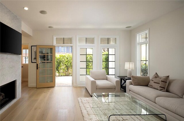 2534 Bungalow Pl Unit 87, Corona Del Mar, CA 92625 - living room featuring a fireplace, light wood finished floors, and recessed lighting