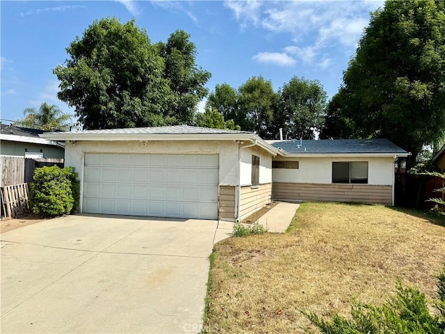 17227 Minnehaha St, Granada Hills, CA 91344 - ranch-style house with a garage, stucco siding, and driveway