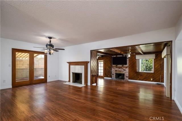 1321 Edgemont St, La Habra, CA 90631 - unfurnished living room with a brick fireplace, wood finished floors, ceiling fan, wood walls, and a textured ceiling
