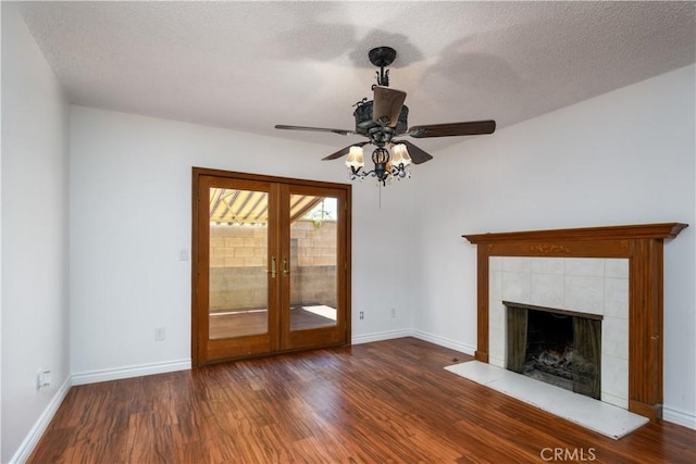 1321 Edgemont St, La Habra, CA 90631 - unfurnished living room with wood finished floors, a fireplace, ceiling fan, french doors, and a textured ceiling