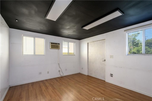 1321 Edgemont St, La Habra, CA 90631 - spare room featuring light wood-style floors and a wall mounted air conditioner