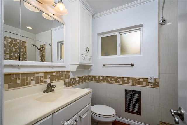 1321 Edgemont St, La Habra, CA 90631 - bathroom with tile walls, tiled shower, vanity, crown molding, and a wainscoted wall