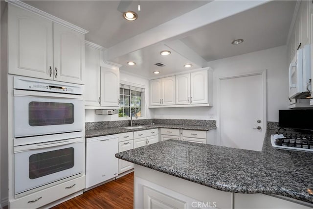 1321 Edgemont St, La Habra, CA 90631 - kitchen featuring white appliances, recessed lighting, white cabinetry, dark stone counters, and a peninsula