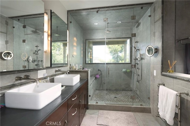 23640 Aster Trl, Calabasas, CA 91302 - full bathroom with tile walls, tile patterned floors, a shower stall, and double vanity