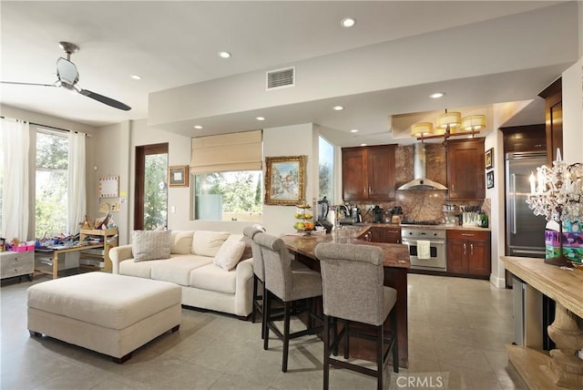 23640 Aster Trl, Calabasas, CA 91302 - living area with recessed lighting, a chandelier, and a ceiling fan