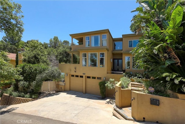 23640 Aster Trl, Calabasas, CA 91302 - view of front of home with a garage, driveway, and stucco siding