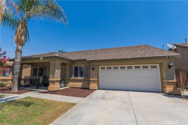 10606 Anacostia Way, Bakersfield, CA 93311 - ranch-style house with stucco siding, concrete driveway, an attached garage, and a tile roof