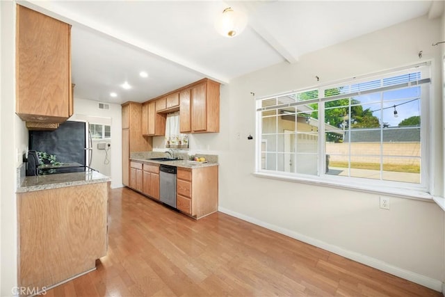 1206 E Vine Ave, West Covina, CA 91790 - kitchen with stainless steel dishwasher, light wood-style floors, beamed ceiling, a fireplace with raised hearth, and recessed lighting