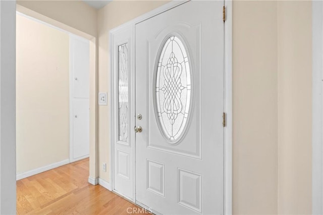 1206 E Vine Ave, West Covina, CA 91790 - entryway with light wood-type flooring and baseboards