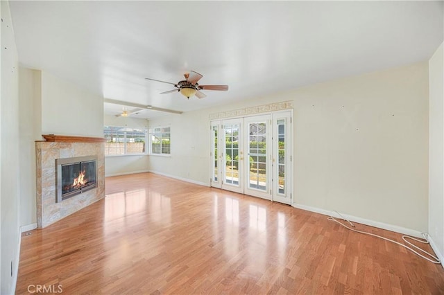 1206 E Vine Ave, West Covina, CA 91790 - unfurnished living room with a ceiling fan, a fireplace, and wood finished floors