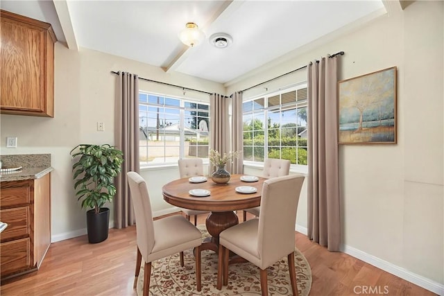 1206 E Vine Ave, West Covina, CA 91790 - dining area with light wood-type flooring and beamed ceiling