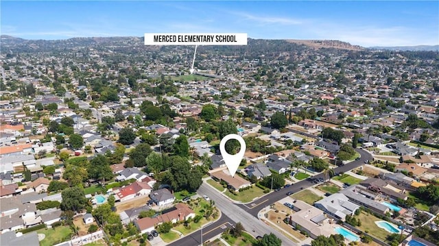 1206 E Vine Ave, West Covina, CA 91790 - aerial overview of property's location with a mountainous background and nearby suburban area