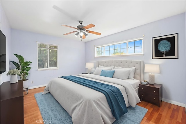 1206 E Vine Ave, West Covina, CA 91790 - bedroom with multiple windows, wood finished floors, and a ceiling fan