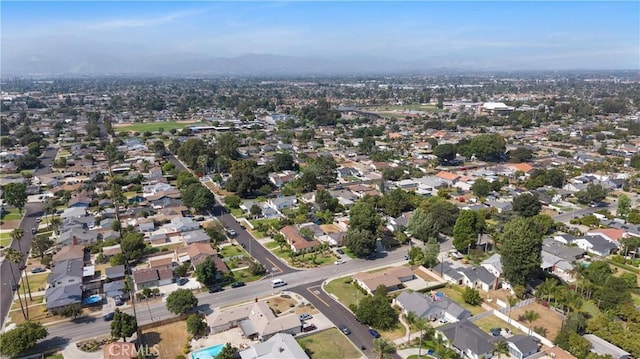 1206 E Vine Ave, West Covina, CA 91790 - aerial view of property and surrounding area featuring mountains and nearby suburban area
