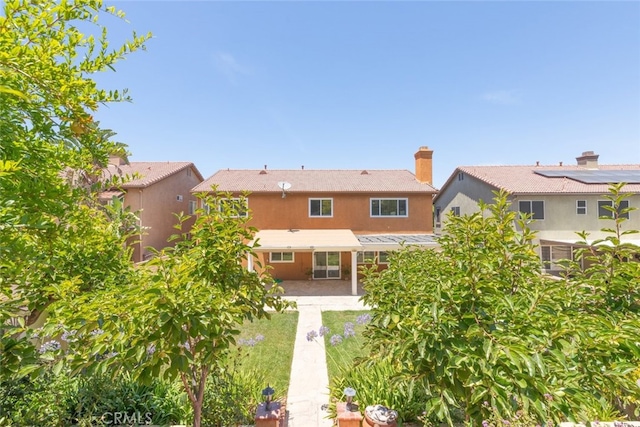 4262 Havenridge, Corona, CA 92883 - rear view of house with a patio, stucco siding, a metal roof, and a standing seam roof