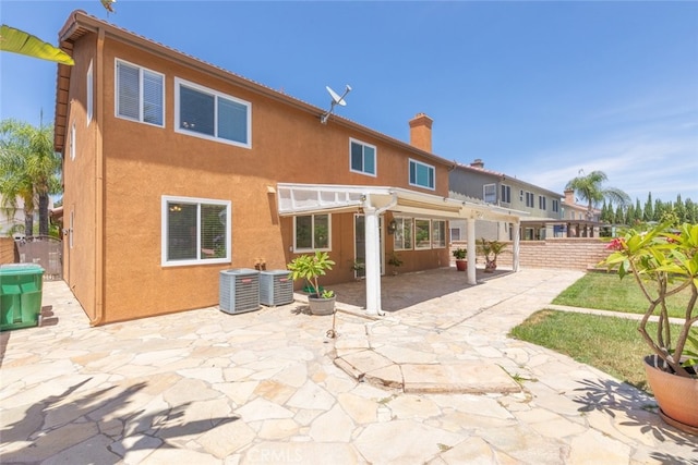 4262 Havenridge, Corona, CA 92883 - back of house featuring a pergola, a patio area, a chimney, and stucco siding