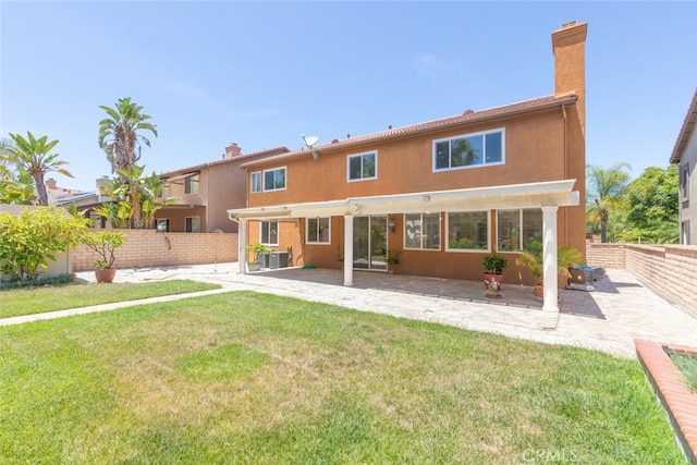 4262 Havenridge, Corona, CA 92883 - rear view of property featuring a chimney, a patio area, a fenced backyard, and stucco siding