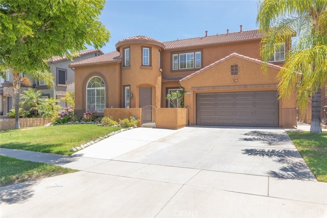 4262 Havenridge, Corona, CA 92883 - mediterranean / spanish house featuring a tile roof, driveway, stucco siding, and a gate