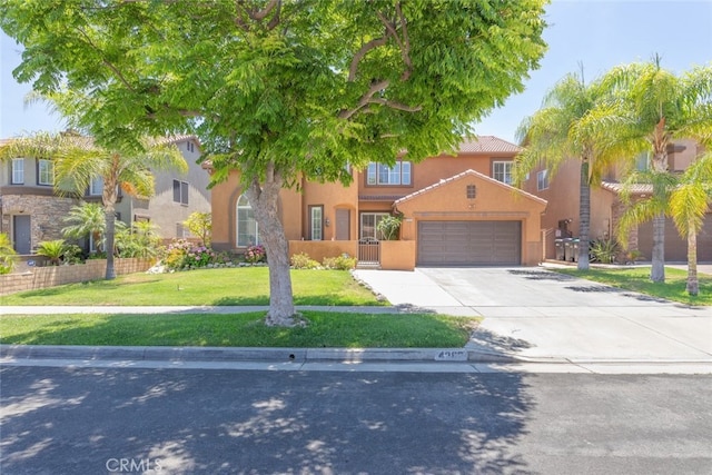 4262 Havenridge, Corona, CA 92883 - mediterranean / spanish-style home featuring driveway, a front lawn, stucco siding, and a garage