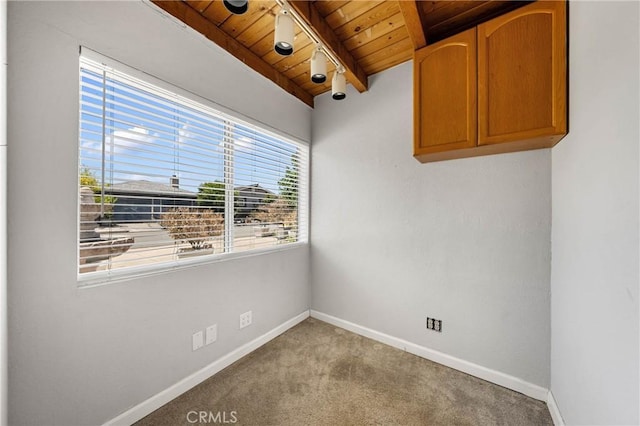 7762 Cora Dr, Lucerne, CA 95458 - carpeted spare room with a wooden ceiling with exposed beams and baseboards