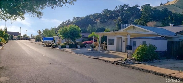 7762 Cora Dr, Lucerne, CA 95458 - view of asphalt road featuring curbs