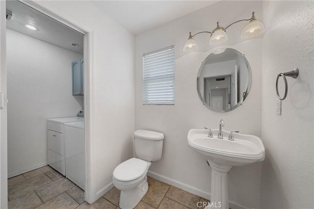 7762 Cora Dr, Lucerne, CA 95458 - bathroom with washing machine and dryer and tile patterned flooring