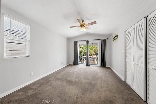 7762 Cora Dr, Lucerne, CA 95458 - unfurnished bedroom with access to outside, vaulted ceiling, carpet floors, a closet, and ceiling fan
