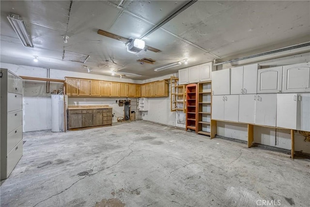7762 Cora Dr, Lucerne, CA 95458 - garage with water heater and a garage door opener