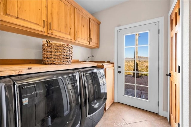7423 Juniper Rd, Joshua Tree, CA 92252 - washroom featuring cabinet space, independent washer and dryer, and light tile patterned floors