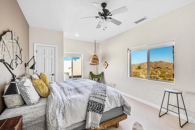 7423 Juniper Rd, Joshua Tree, CA 92252 - bedroom featuring wood finished floors and a ceiling fan