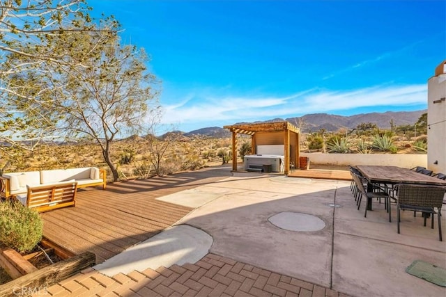 7423 Juniper Rd, Joshua Tree, CA 92252 - view of patio / terrace with a hot tub, outdoor dining space, outdoor lounge area, a pergola, and a deck with mountain view