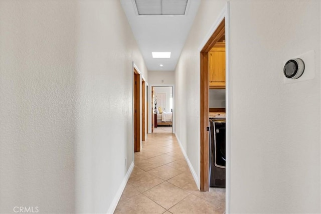 7423 Juniper Rd, Joshua Tree, CA 92252 - hallway featuring light tile patterned flooring and washer / clothes dryer