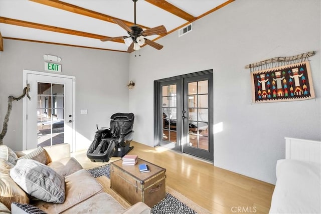 7423 Juniper Rd, Joshua Tree, CA 92252 - living area with french doors, wood finished floors, a ceiling fan, healthy amount of natural light, and beamed ceiling