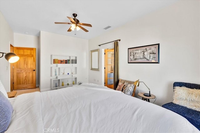 7423 Juniper Rd, Joshua Tree, CA 92252 - bedroom with ceiling fan and wood finished floors