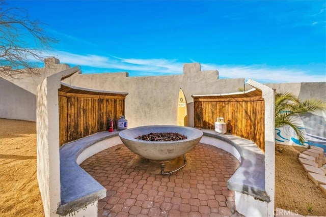 7423 Juniper Rd, Joshua Tree, CA 92252 - view of patio featuring a fire pit