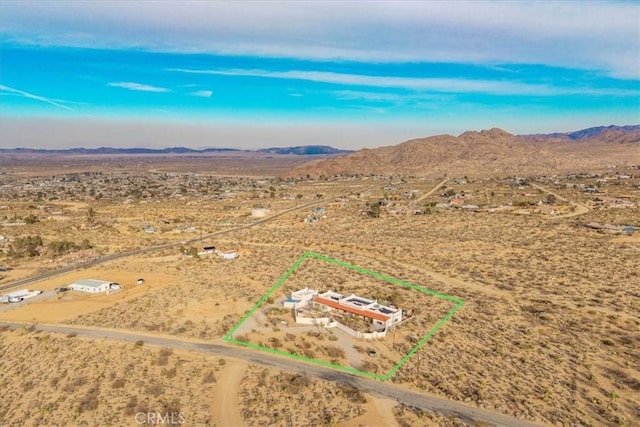 7423 Juniper Rd, Joshua Tree, CA 92252 - overview of rural landscape with a mountain backdrop and property boundaries highlighted