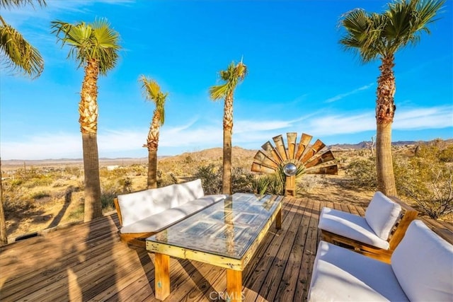 7423 Juniper Rd, Joshua Tree, CA 92252 - wooden terrace with a mountain view and outdoor dining area