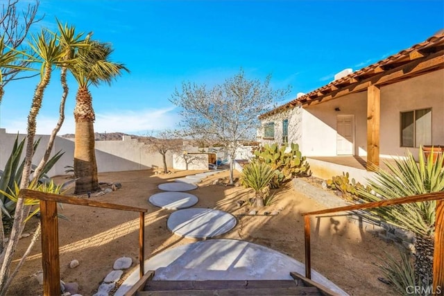 7423 Juniper Rd, Joshua Tree, CA 92252 - fenced backyard with a patio area